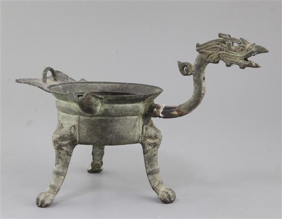 A Chinese archaic bronze tripod ritual wine-warming vessel, Jiao Dou, Southern & Northern dynasties, 6th century A.D., 31cm long, 22cm